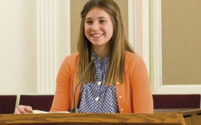 When did it become a practice to have members invited or assigned to give talks in Sacrament Meeting?