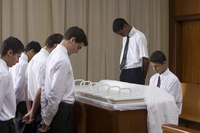 Should chapel doors be open or closed during the Sacrament?