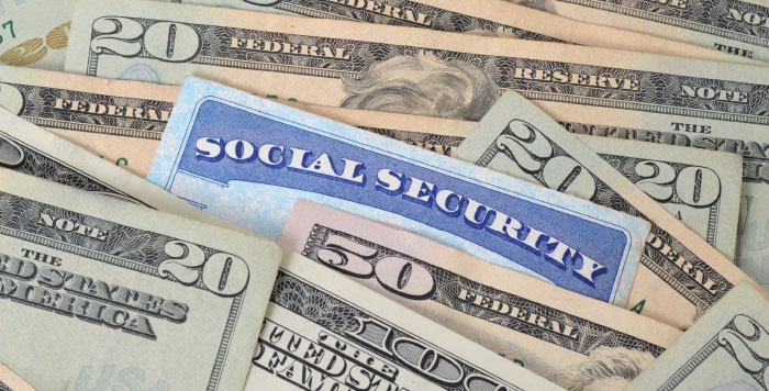 Social Security Card Surrounded by Dollar Bills | Questions for LDS | Should I Pay Tithing on Social Security Benefits?